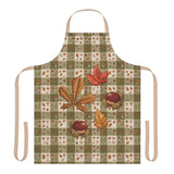 Chestnut & Mushroom fall apron, olive green gingham with chestnuts and mushrooms, worn in a kitchen