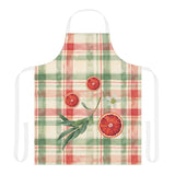 Blood Orange & Olive Plaid Christmas apron laid flat, sliced blood oranges and an olive sprig on red and sage green plaid