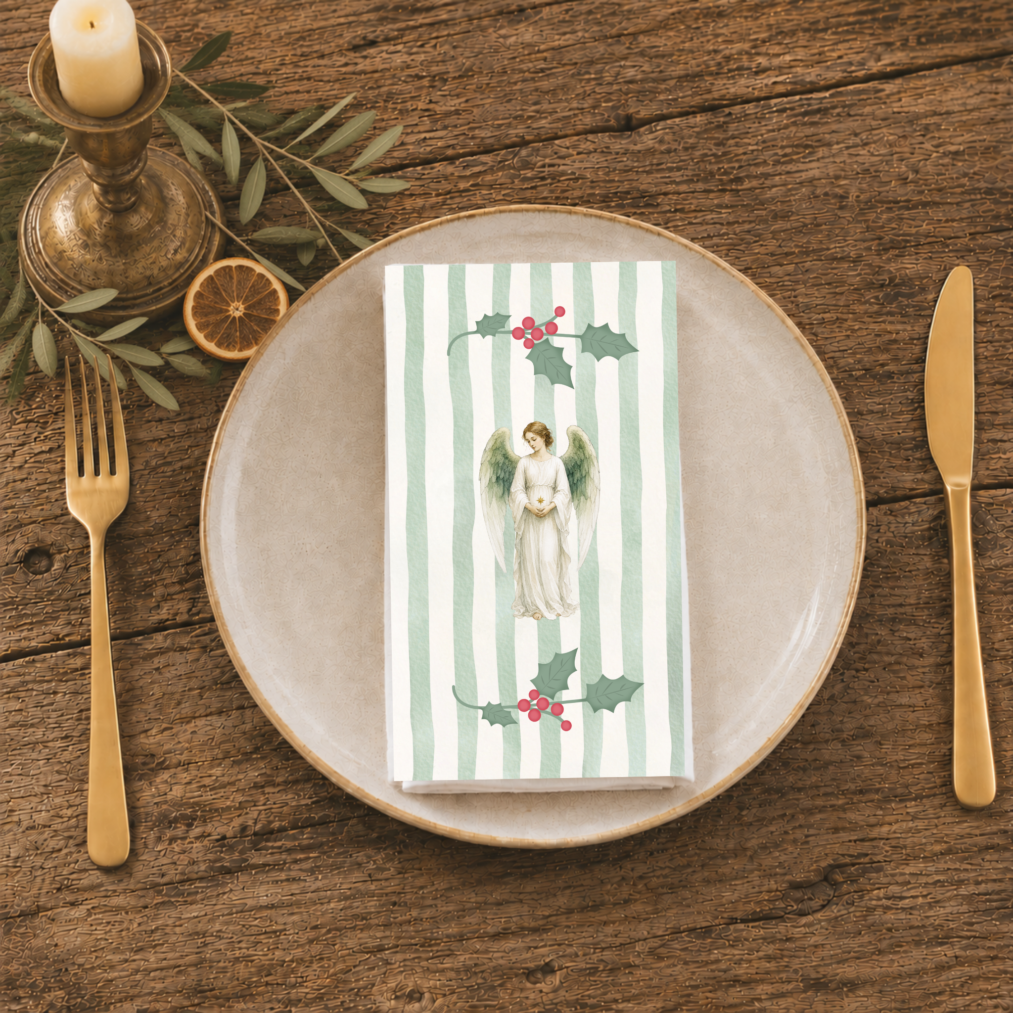 Angels and holly napkin folded on a stoneware plate with gold cutlery and a brass candlestick