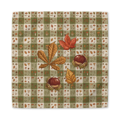 Chestnut & Mushroom fall cloth napkin, mushrooms and autumn leaves on a green check, at a laid place setting