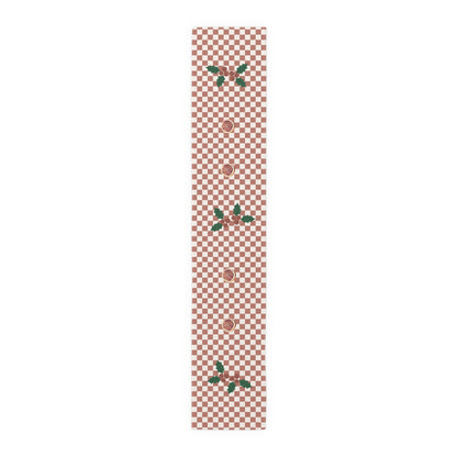 Blood orange check Christmas table runner laid flat, the check running out to the hemmed edge