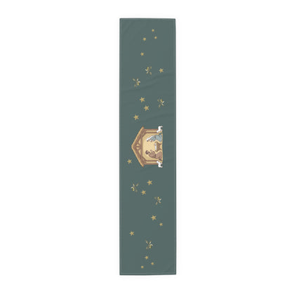 Nativity & Olive Christmas table runner shown flat, a nativity stable with gold stars and olive sprigs on deep green