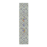Grape & Pumpkin fall table runner, purple grapes and vine leaves on blue and yellow gingham, on a wooden dining table