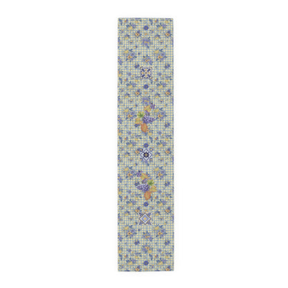 Grape & Pumpkin fall table runner, purple grapes and vine leaves on blue and yellow gingham, on a wooden dining table