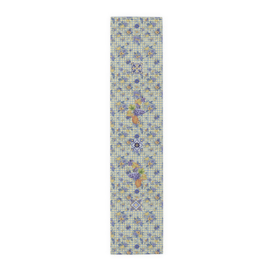 Grape & Pumpkin fall table runner, purple grapes and vine leaves on blue and yellow gingham, on a wooden dining table