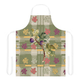 Fig & Maple fall apron, figs and maple leaves on sage green tartan, worn in a kitchen
