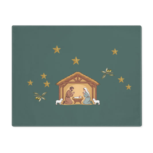 Nativity & Olive Christmas placemat shown flat, a nativity stable with gold stars and olive sprigs on deep green