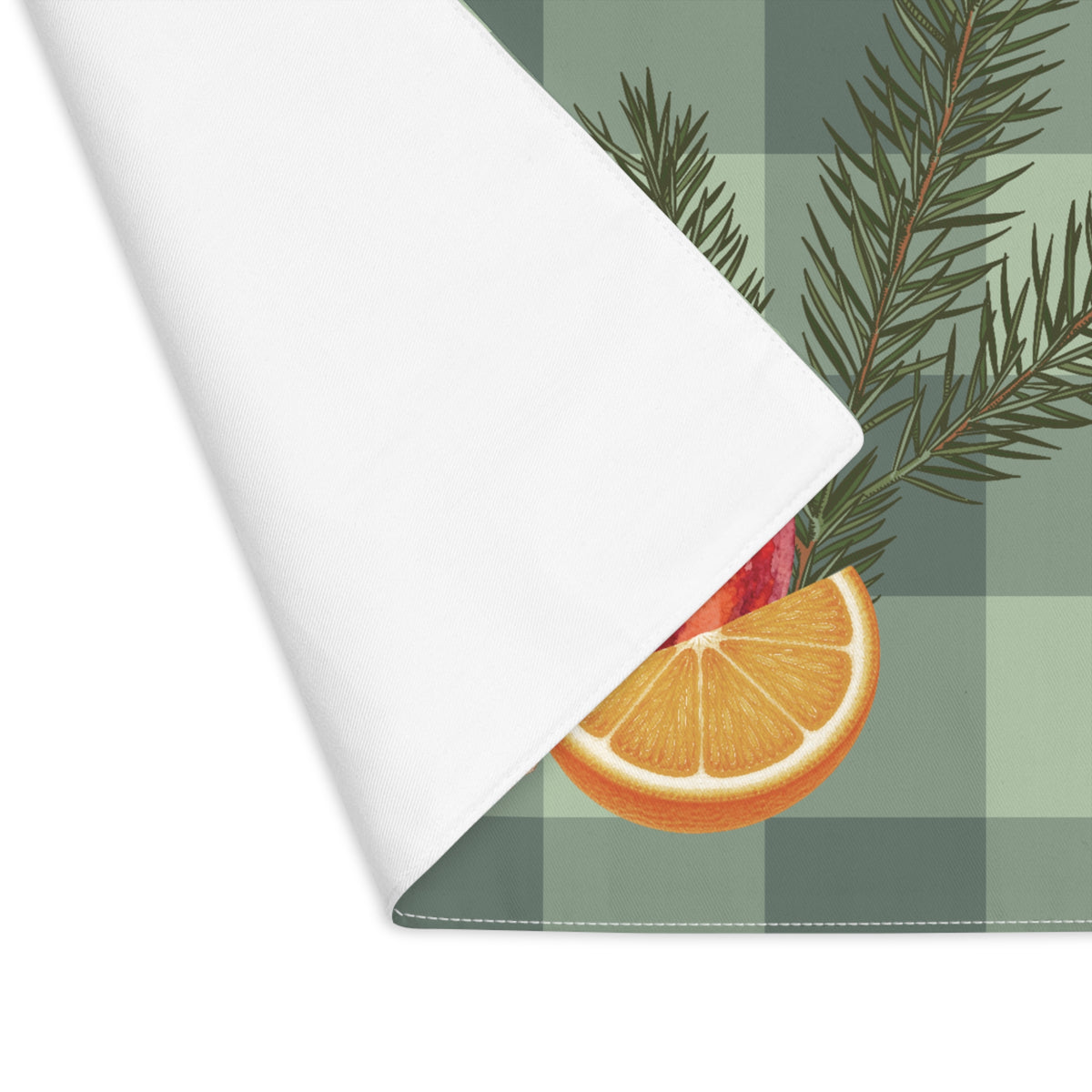 Pomegranate & Pine Gingham Christmas placemat, a pomegranate, pine cone, orange slice and gold star under a pine spray on a sage green gingham check