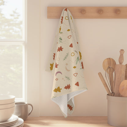 Lemon and pine Christmas kitchen towel hanging beside a sunlit kitchen window