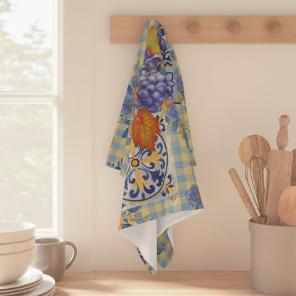 Grape & Pumpkin fall tea towel, majolica tile detail in the print, on a wooden worktop