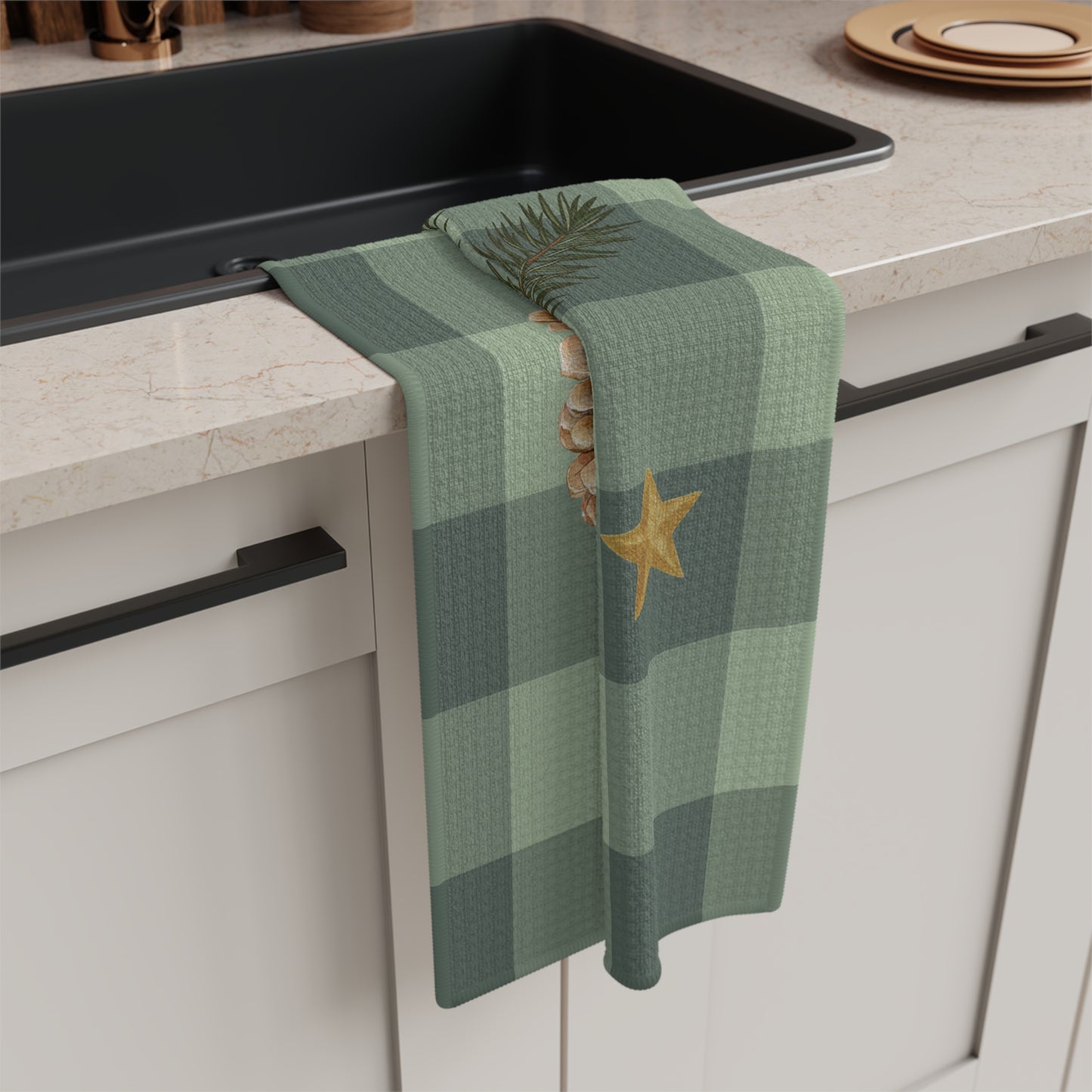 Pomegranate & Pine Gingham Christmas tea towel, a pomegranate, pine cone, orange slice and gold star under a pine spray on a sage green gingham check