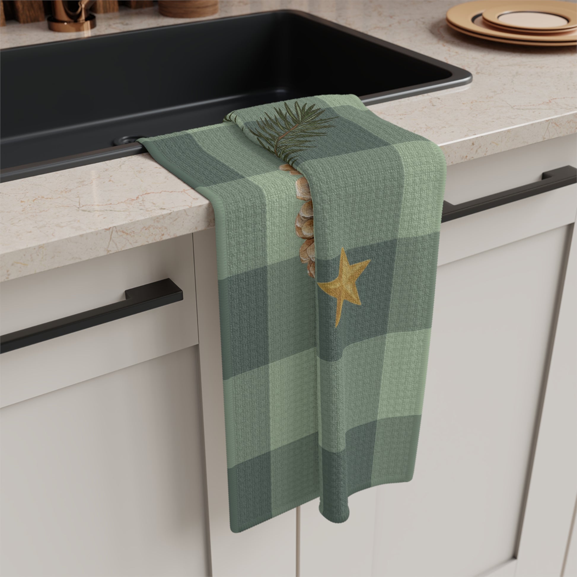 Pomegranate & Pine Gingham Christmas tea towel, a pomegranate, pine cone, orange slice and gold star under a pine spray on a sage green gingham check