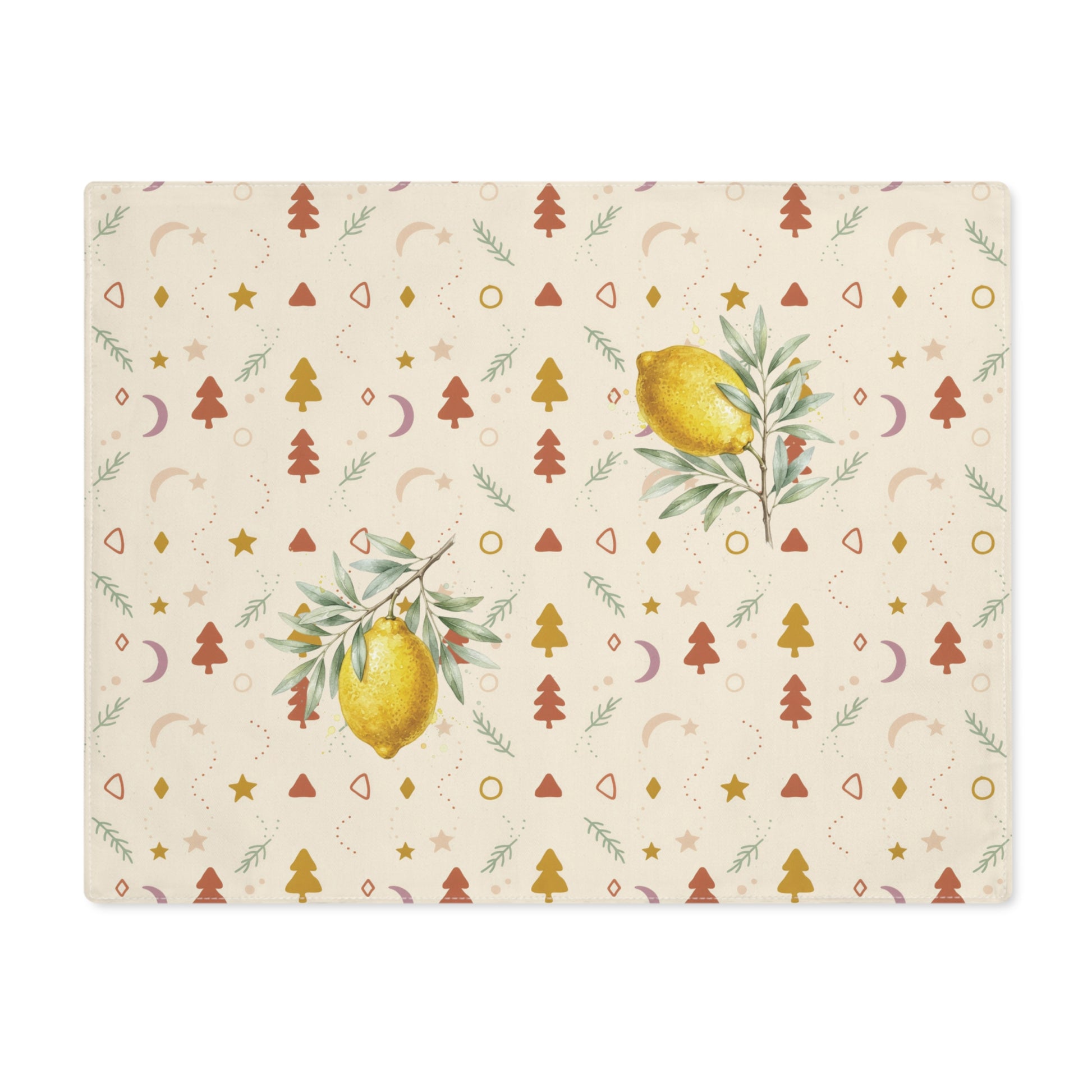 Lemon and pine Christmas placemat laid flat, with watercolour lemons among small rust and gold Christmas trees, stars and crescent moons on cream