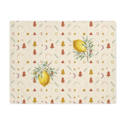Lemon and pine Christmas placemat laid flat, with watercolour lemons among small rust and gold Christmas trees, stars and crescent moons on cream