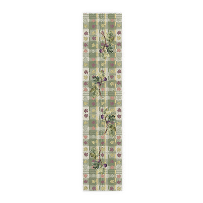 Fig & Maple fall table runner, purple figs and maple leaves on sage green tartan, on a wooden dining table