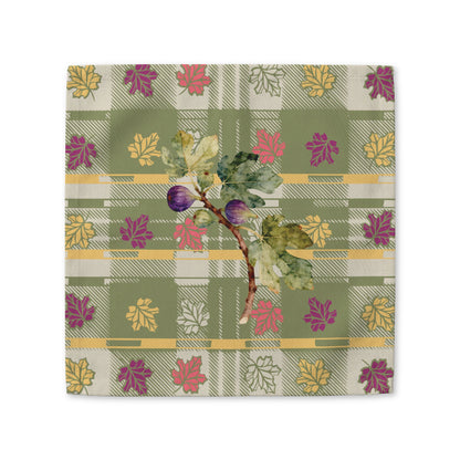 Fig & Maple fall cloth napkin, figs and maple leaves on sage green tartan, folded on a plate