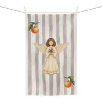 Angels and oranges Christmas tea towel on a washing line, shown flat with the angel and pine sprig on a soft grey stripe, an orange above and below
