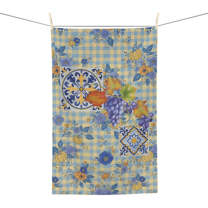 Grape & Pumpkin fall tea towel, grapes and pumpkins on blue and yellow gingham, hanging in a kitchen
