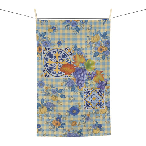 Grape & Pumpkin fall tea towel, grapes and pumpkins on blue and yellow gingham, hanging in a kitchen