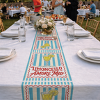Limoncello Amore Mio table runner down a long white banquet table set with flowers