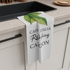 Limoncello tea towel draped over the edge of a kitchen cabinet