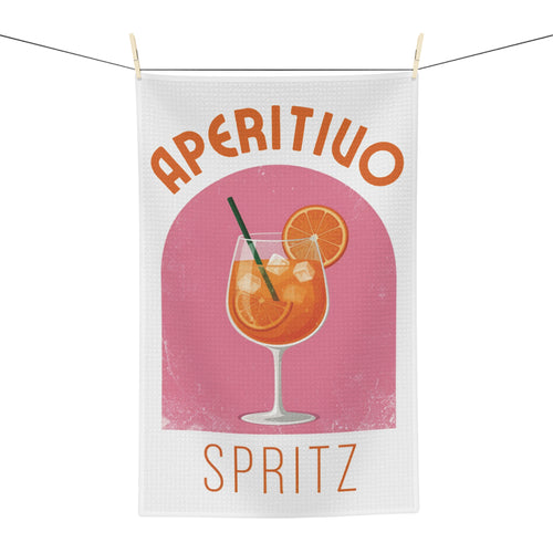 Aperitivo Spritz tea towel hanging, showing the pink panel with a spritz glass and Aperitivo Spritz lettering