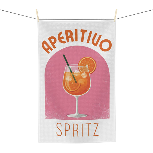 Aperitivo Spritz tea towel hanging, showing the pink panel with a spritz glass and Aperitivo Spritz lettering