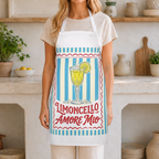 Limoncello Amore Mio apron worn in a kitchen, showing the striped ground and the retro Limoncello label on a white body