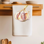 Garlic tea towel folded over a wooden shelf rail above a kitchen counter