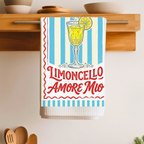 Limoncello Amore Mio tea towel folded over a wooden shelf rail above a kitchen counter