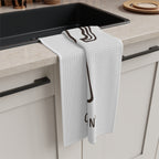 Caffè Italiano tea towel draped over the edge of a kitchen cabinet