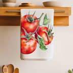 Tomato tea towel folded over a wooden shelf rail above a kitchen counter