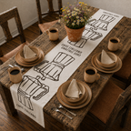 Caffè Italiano table runner on a wooden table with plates, cups and a small potted plant