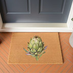 Artichoke doormat on terracotta brick tiles in front of a dark blue-grey door