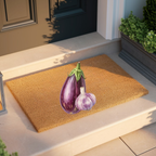Eggplant and Garlic doormat on a pale stone step beside a clipped hedge in a planter