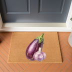 Eggplant and Garlic doormat on terracotta brick tiles in front of a dark blue-grey door