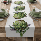 Artichoke table runner on a dark wooden table with green plates and glasses
