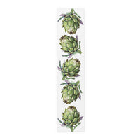 Artichoke table runner in cotton twill, 16 by 72 inches, laid flat with a repeating watercolor artichoke pattern
