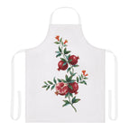 Pomegranate apron laid flat, showing the pomegranate branch with red blossom on a white body