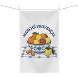 Marché Provençal tea towel hanging, showing the blue-and-white bowl of citrus fruit on tiles