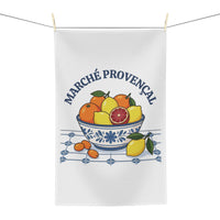 Marché Provençal tea towel hanging, showing the blue-and-white bowl of citrus fruit on tiles