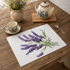 Lavender placemat on a wooden table with a blue-patterned cup and teapot and a jug of wildflowers