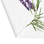 Lavender placemat with one corner turned back, showing the hemmed edge and the plain reverse