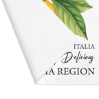 Limoncello placemat with one corner turned back, showing the hemmed edge and the plain reverse