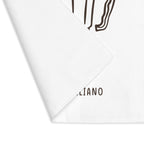 Caffè Italiano placemat with one corner turned back, showing the hemmed edge and the plain reverse