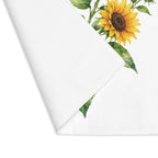 Sunflower placemat with one corner turned back, showing the hemmed edge and the plain reverse