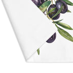Olive Branch placemat with one corner turned back, showing the hemmed edge and the plain reverse