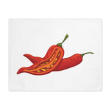 Chili Pepper placemat laid flat, showing two red chilies on white cotton twill