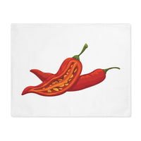 Chili Pepper placemat laid flat, showing two red chilies on white cotton twill