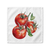 Tomato cloth napkin laid flat, showing three watercolor tomatoes on the vine with green stems and leaves